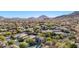 Aerial view of home nestled in a mountain community at 6857 W Juana Dr, Peoria, AZ 85383