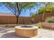 Relaxing backyard firepit area, perfect for outdoor gatherings at 6857 W Juana Dr, Peoria, AZ 85383