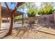 Landscaped backyard with a pergola and mature trees at 6857 W Juana Dr, Peoria, AZ 85383