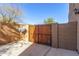 Private backyard access with a wooden gate at 6857 W Juana Dr, Peoria, AZ 85383