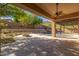 Covered patio overlooking a sparkling pool and fire pit at 6857 W Juana Dr, Peoria, AZ 85383