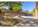 Landscaped backyard with fire pit and a refreshing pool at 6857 W Juana Dr, Peoria, AZ 85383