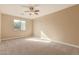 Bright bedroom with window and ceiling fan at 6857 W Juana Dr, Peoria, AZ 85383