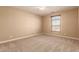 Well-lit bedroom with neutral walls and carpeted floors at 6857 W Juana Dr, Peoria, AZ 85383