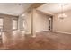 Open dining room with tile floors and views into the kitchen at 6857 W Juana Dr, Peoria, AZ 85383