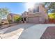 Two-story house with a large driveway and desert landscaping at 6857 W Juana Dr, Peoria, AZ 85383