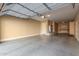 Spacious garage with built-in cabinets and epoxy flooring at 6857 W Juana Dr, Peoria, AZ 85383