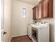 Laundry room with washer, dryer, and ample cabinet space at 6857 W Juana Dr, Peoria, AZ 85383