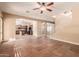 Open living room with tile floors and kitchen views at 6857 W Juana Dr, Peoria, AZ 85383