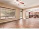 Bright living room with tile floors and view into kitchen at 6857 W Juana Dr, Peoria, AZ 85383