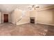 Living room with fireplace, tile floors, and staircase at 6857 W Juana Dr, Peoria, AZ 85383