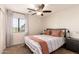 Bright bedroom with a comfortable bed and ceiling fan at 6902 S 14Th Dr, Phoenix, AZ 85041