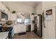 Modern kitchen with white cabinets, stainless steel appliances and quartz countertops at 6902 S 14Th Dr, Phoenix, AZ 85041