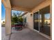 Covered patio with seating area, adjacent to the pool at 6902 S 14Th Dr, Phoenix, AZ 85041