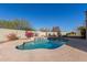 Relaxing kidney-shaped pool with water feature at 6902 S 14Th Dr, Phoenix, AZ 85041