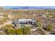 Aerial view of a home with a pool, showcasing its unique desert setting and landscape at 7002 E Leisure Ln, Carefree, AZ 85377