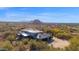 Single-story home with a private driveway and desert landscape at 7002 E Leisure Ln, Carefree, AZ 85377