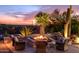 Sunset view, firepit, and comfortable seating area in a desert setting at 7002 E Leisure Ln, Carefree, AZ 85377