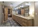 Double vanity bathroom with granite countertop and wood cabinets at 7002 E Leisure Ln, Carefree, AZ 85377