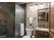 Bathroom with stone tile and granite vanity at 7002 E Leisure Ln, Carefree, AZ 85377