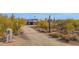 Long private driveway leading to a stunning desert home with mountain views at 7002 E Leisure Ln, Carefree, AZ 85377