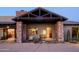 Stone pillars and a covered entryway with seating and a view of the interior at 7002 E Leisure Ln, Carefree, AZ 85377