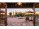 View through doorway to a relaxing pool area and desert landscape at 7002 E Leisure Ln, Carefree, AZ 85377