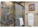 Shower with glass enclosure and slate tile surround at 7002 E Leisure Ln, Carefree, AZ 85377