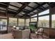 Sunroom lounge area with wicker furniture and a TV at 7002 E Leisure Ln, Carefree, AZ 85377