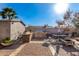 Outdoor kitchen and patio area with seating at 7135 W Heatherbrae Dr, Phoenix, AZ 85033