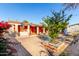 Large backyard with patio, basketball hoop, and outdoor seating at 7135 W Heatherbrae Dr, Phoenix, AZ 85033