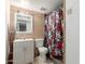 Bathroom with a shower/tub combo and updated vanity at 7135 W Heatherbrae Dr, Phoenix, AZ 85033