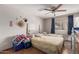 Bedroom with two twin beds and ceiling fan at 7135 W Heatherbrae Dr, Phoenix, AZ 85033