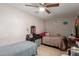 Cozy bedroom with two twin beds and ceiling fan at 7135 W Heatherbrae Dr, Phoenix, AZ 85033