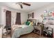 Bedroom with a full-size bed and ceiling fan at 7135 W Heatherbrae Dr, Phoenix, AZ 85033