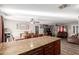 Kitchen with granite island, view of dining and living areas at 7135 W Heatherbrae Dr, Phoenix, AZ 85033