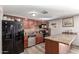 Kitchen with granite countertops and wood cabinets at 7135 W Heatherbrae Dr, Phoenix, AZ 85033