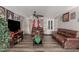 Living Room with Christmas tree and brown couches at 7135 W Heatherbrae Dr, Phoenix, AZ 85033