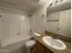 Clean bathroom with tub, shower, and granite vanity at 740 W Elm St # 119, Phoenix, AZ 85013