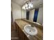 Bathroom with granite countertop, single sink, and large mirror at 740 W Elm St # 119, Phoenix, AZ 85013