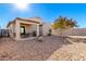 Spacious backyard with gravel landscaping and covered patio at 790 W Jardin Dr, Casa Grande, AZ 85122