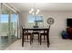 Dining area with a table and chairs near sliding glass doors at 790 W Jardin Dr, Casa Grande, AZ 85122