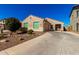 Single-story home with a two-car garage and desert landscaping at 790 W Jardin Dr, Casa Grande, AZ 85122