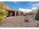 Large backyard with covered patio and desert landscaping at 8047 W Cinder Brook Way, Florence, AZ 85132