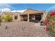 Spacious backyard with covered patio and grill at 8047 W Cinder Brook Way, Florence, AZ 85132