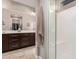 Elegant bathroom with double sinks, a large shower, and ample storage at 8047 W Cinder Brook Way, Florence, AZ 85132