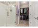 Bathroom with walk-in shower and large closet at 8047 W Cinder Brook Way, Florence, AZ 85132