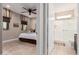 Bedroom with ensuite bathroom and tiled floors at 8047 W Cinder Brook Way, Florence, AZ 85132