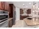 Modern kitchen with double ovens, granite countertops, and ample cabinet space at 8047 W Cinder Brook Way, Florence, AZ 85132