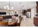 Spacious kitchen with island, stainless steel appliances, and granite countertops at 8047 W Cinder Brook Way, Florence, AZ 85132